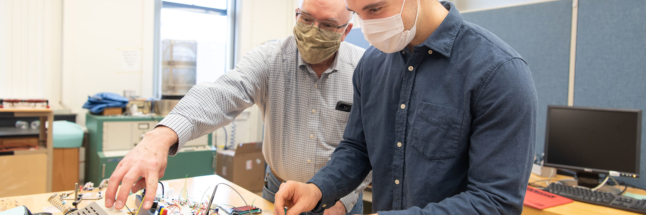 Professor and student in a lab classroom